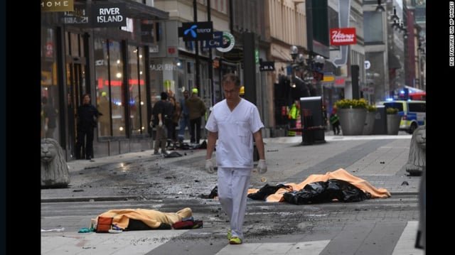 A medical responder moves through the scene of the attack.